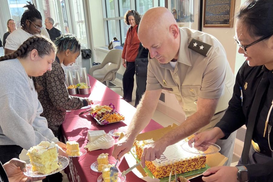 President Anarumo cuts cake at The Guidons 100th anniversary kickoff party.